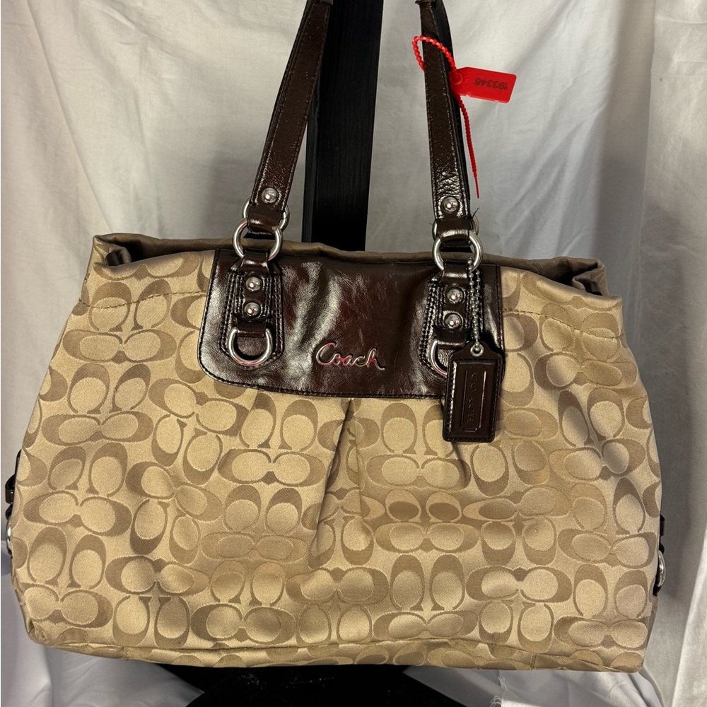 Large coach tote with d-rings.